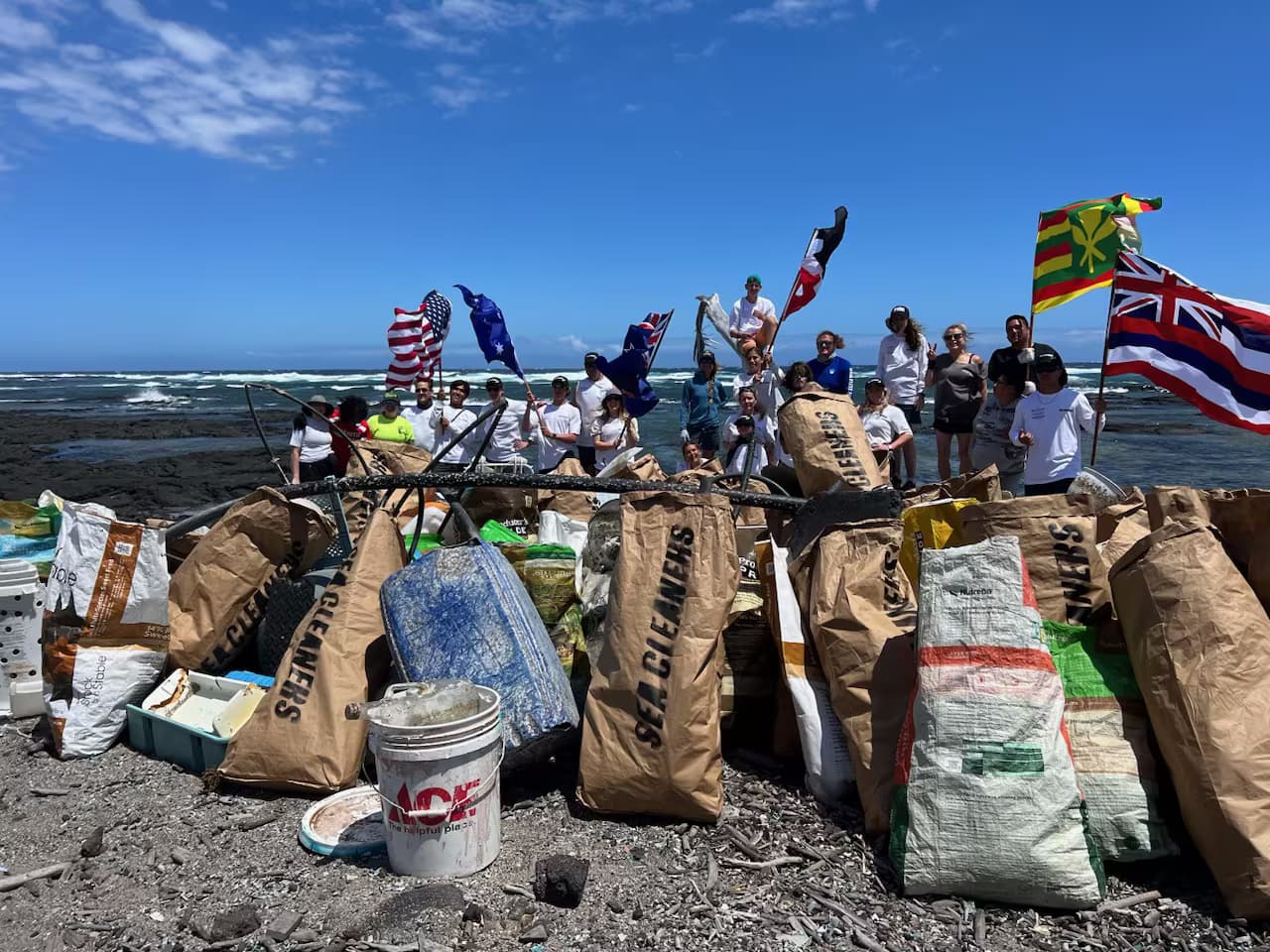 Volunteers at a Hawaii Island coastal cleanup removing marine debris from the shoreline