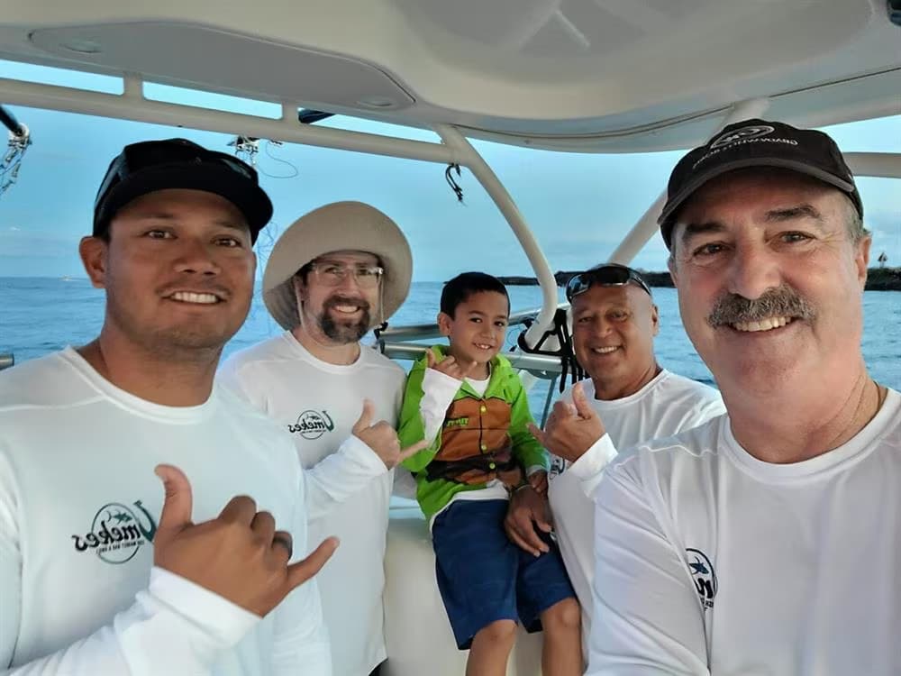 Team Veritas celebrating their winning catch at the Hanapa'a for HUGS benefit fishing tournament in Kona