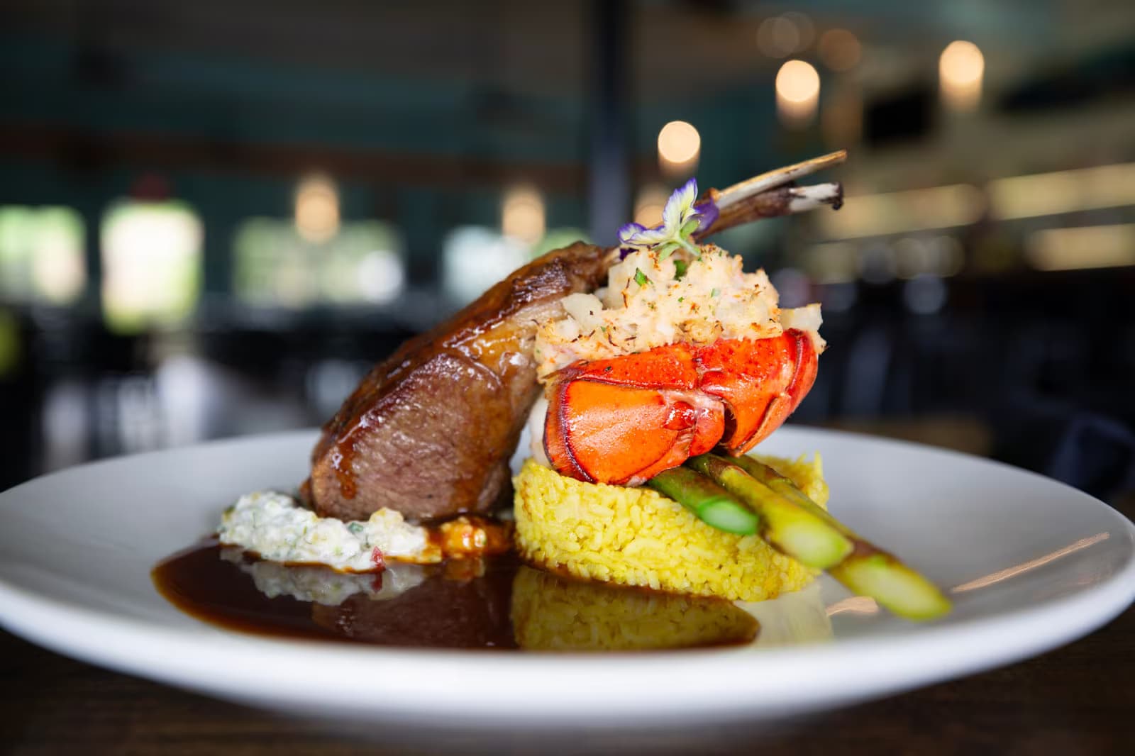 Jackie Rey's service team presenting a plate of chocolate-dipped strawberries