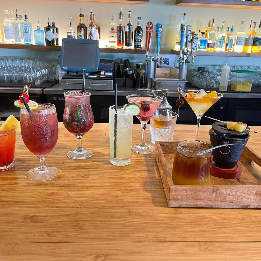 A bar flight of seven handcrafted cocktails at Jackie Rey's