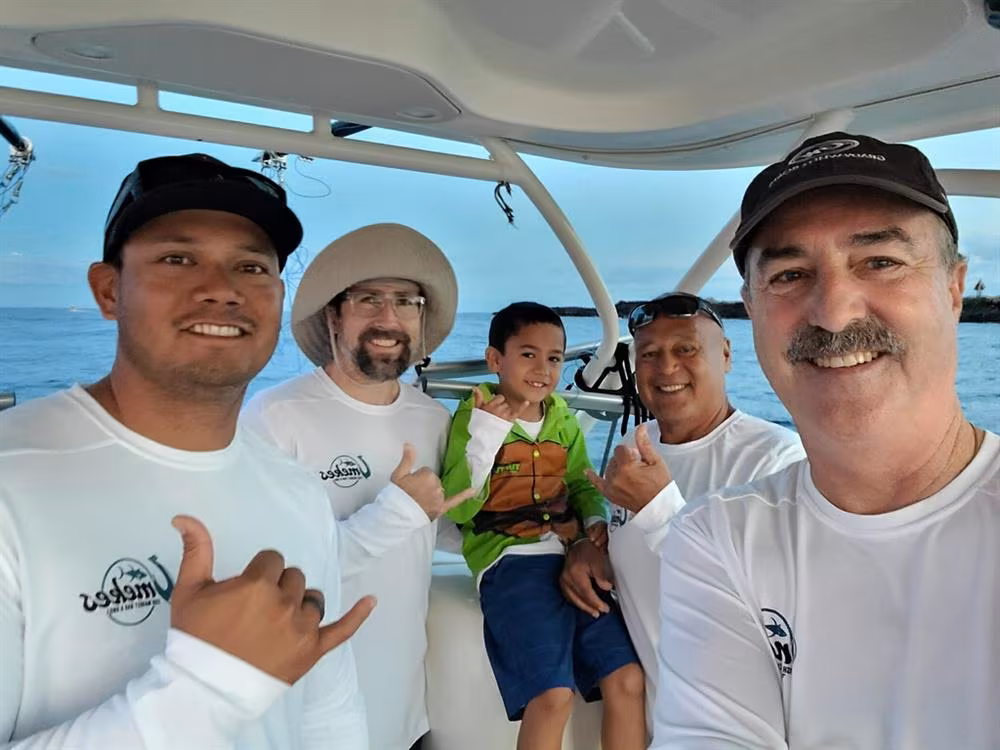 Team Veritas celebrating their winning catch at the Hanapa'a for HUGS benefit fishing tournament in Kona